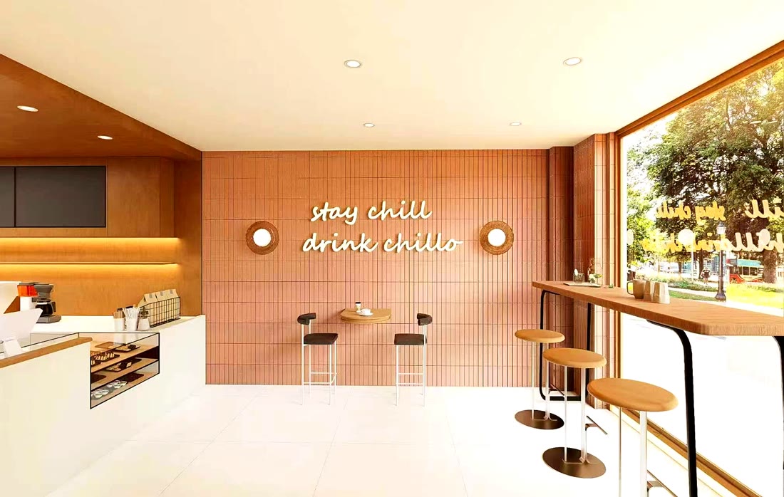 'Stay chill, drink chillo' neon sign on the feature wall at Chillo café